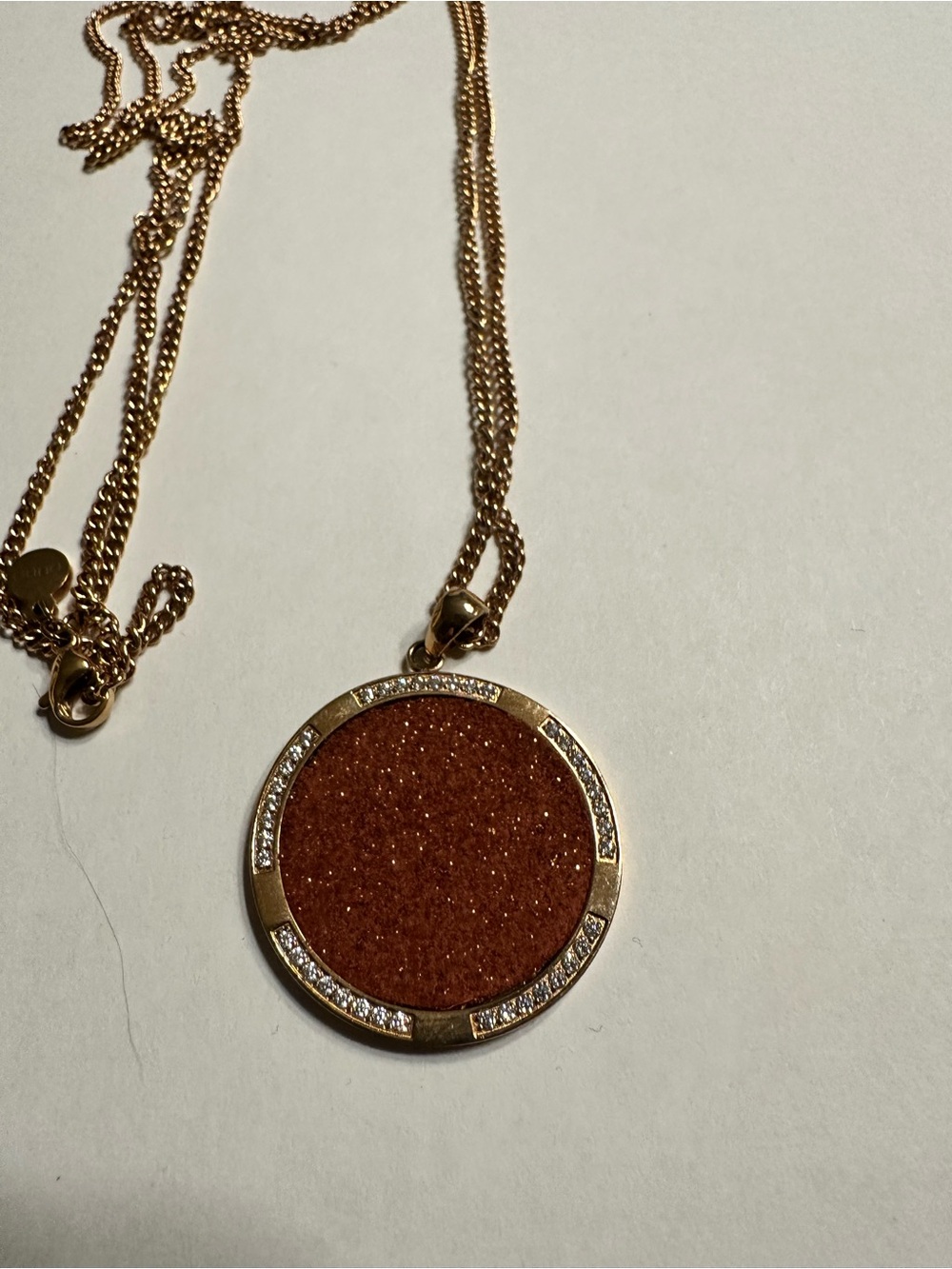 Qudo Gold-Tone Round Rust Glitter Pendant Necklace